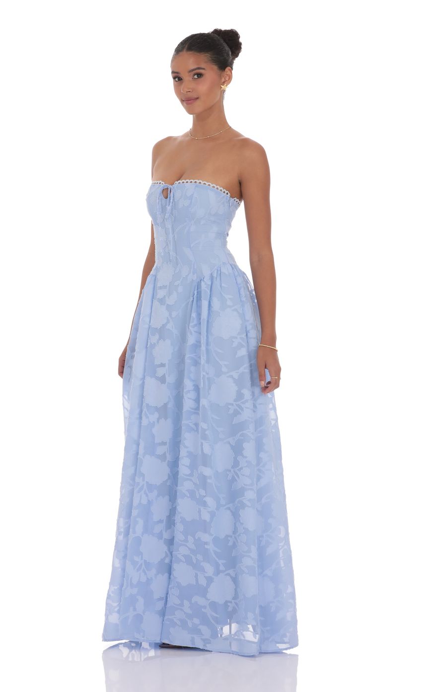 Picture Floral Lace-Up Maxi Dress in Light Blue. Source: https://media-img.lucyinthesky.com/data/product-media/850xAUTO/104b5b09-0110-47b9-b929-0b5c7d1a3f5a.jpg