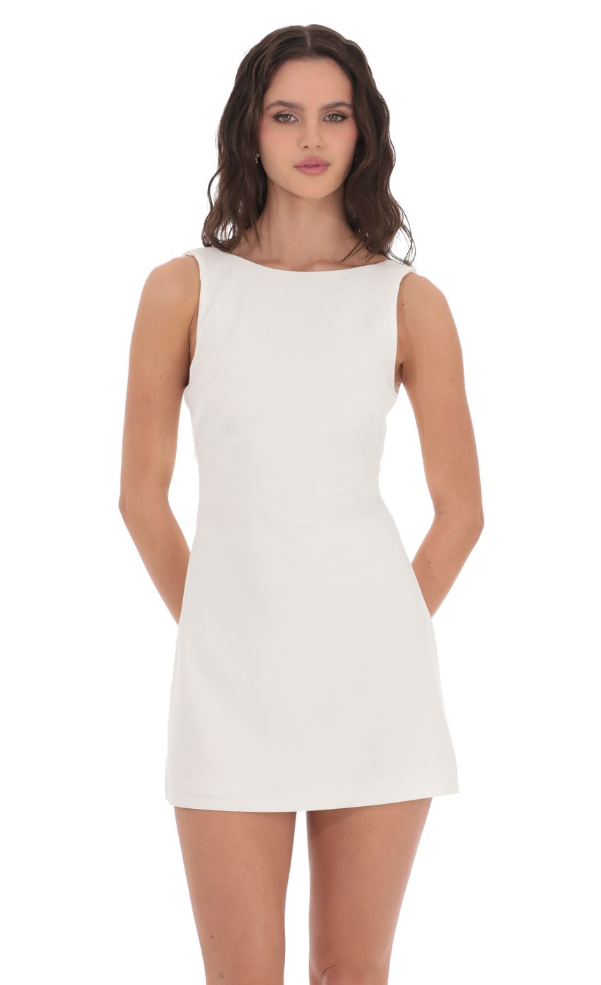 Picture High Neck Back Bow Dress in White. Source: https://media-img.lucyinthesky.com/data/product-media/850xAUTO/1663846e-baed-4909-9403-ec6a38c512f0.jpg