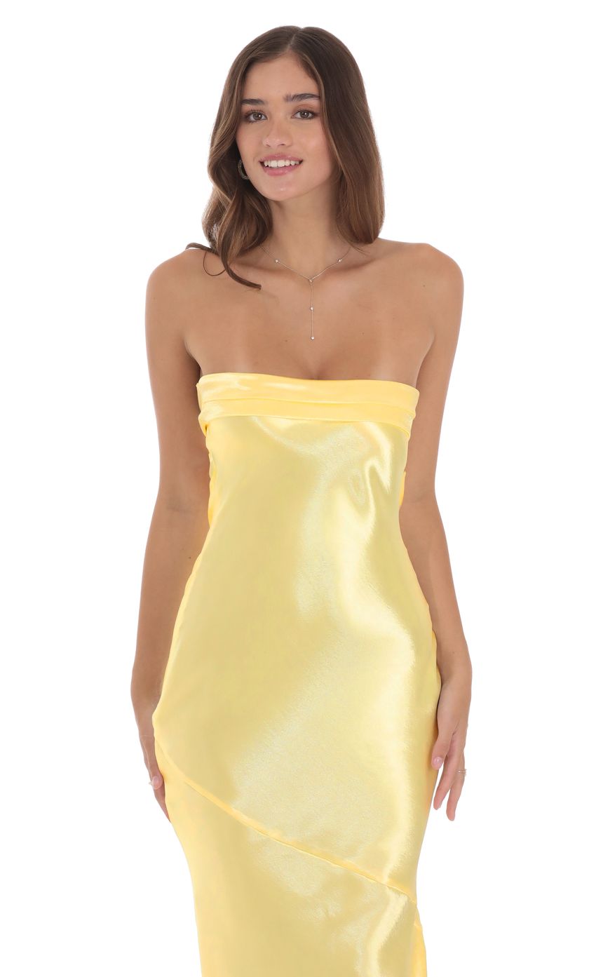 Picture Strapless Satin Open Back Maxi Dress in Yellow. Source: https://media-img.lucyinthesky.com/data/product-media/850xAUTO/2fd70f35-48fb-4bb3-ab65-c87872d4c123.jpg