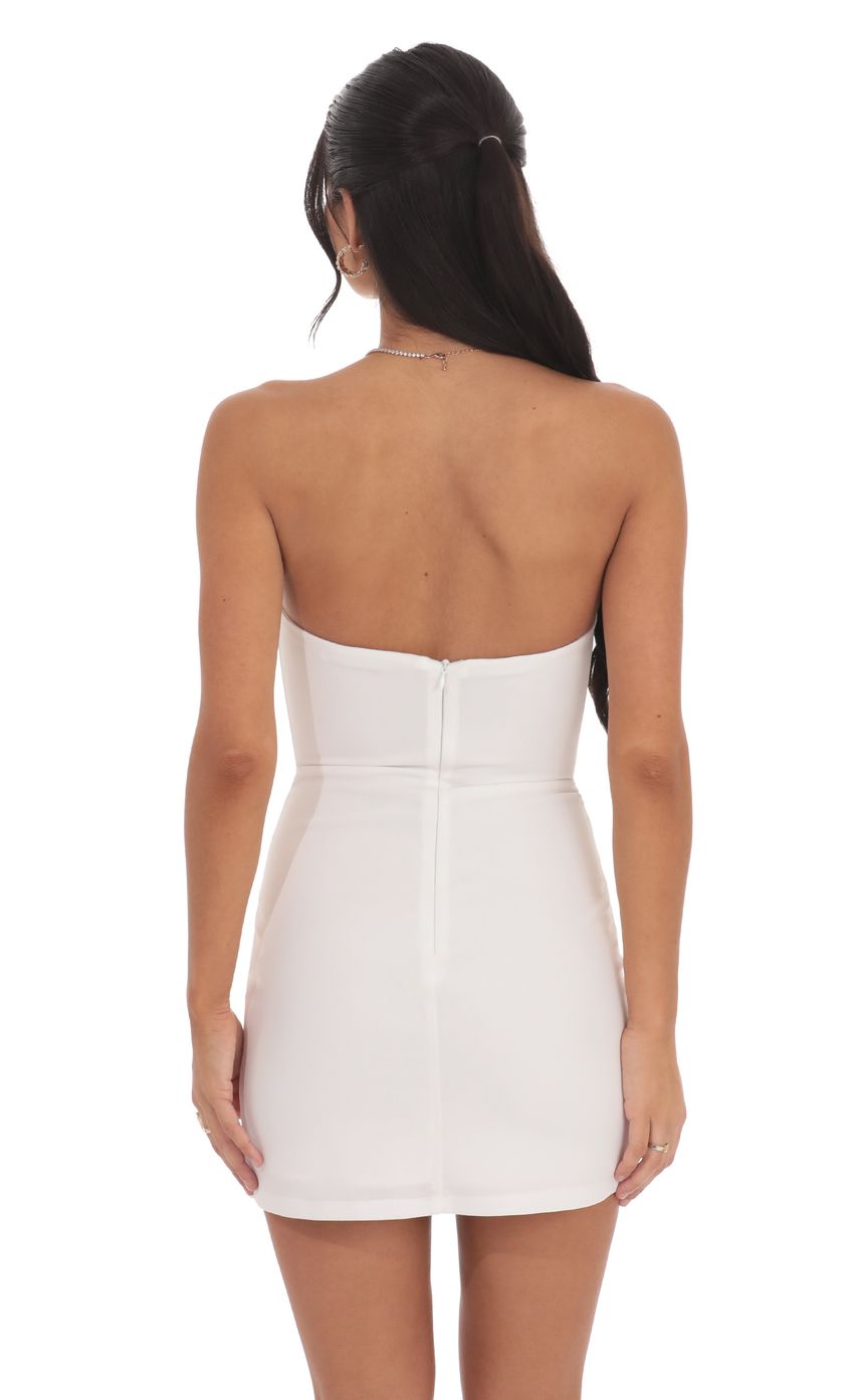 Picture Front Bow Strapless Dress in White. Source: https://media-img.lucyinthesky.com/data/product-media/850xAUTO/3dca5cd6-4e6f-40c9-a4a6-e540c5d54bf7.jpg