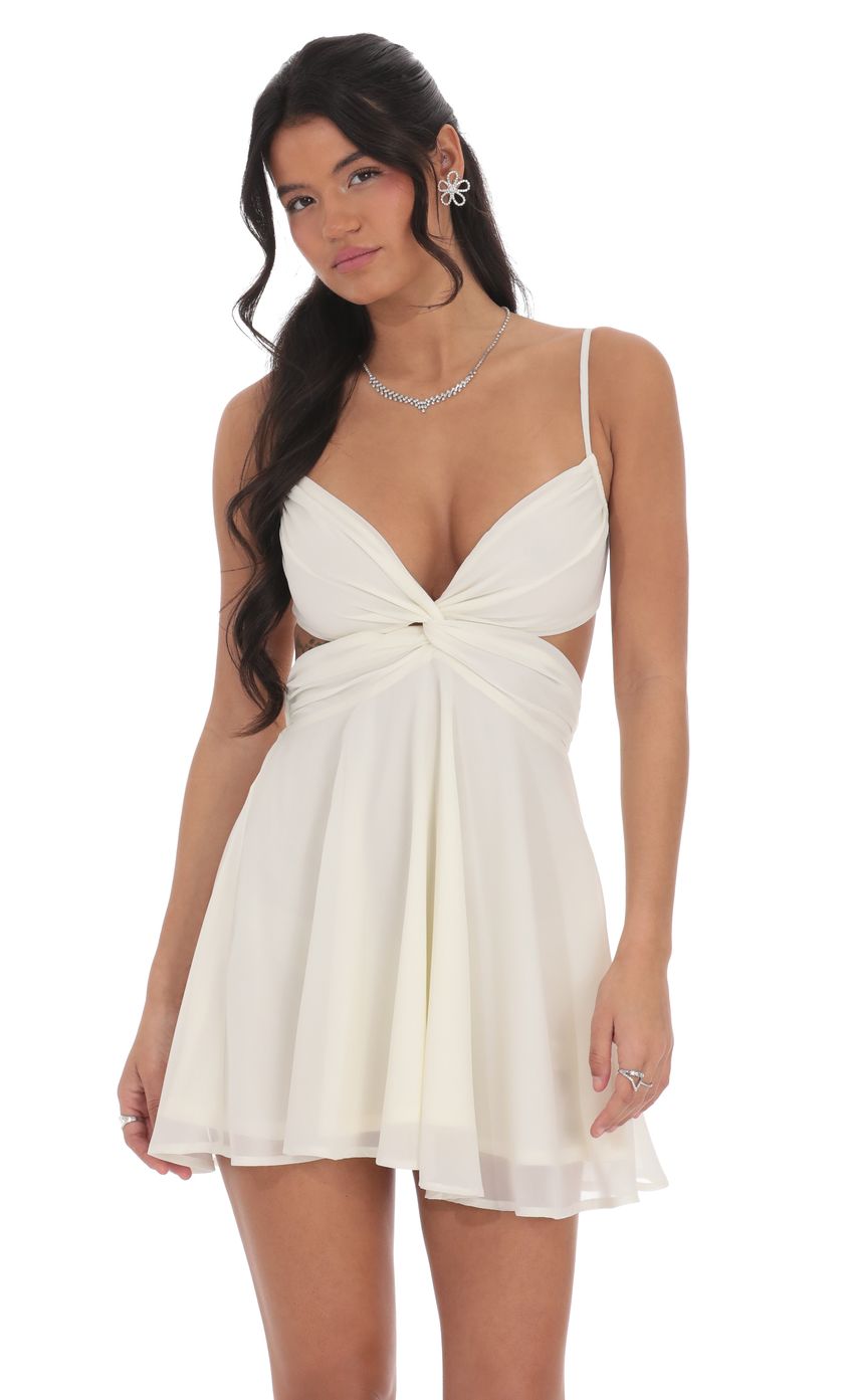 Picture Cutout Fit and Flare Dress in Ivory. Source: https://media-img.lucyinthesky.com/data/product-media/850xAUTO/51208b02-819e-4867-94b4-da8af71b4ce8.jpg
