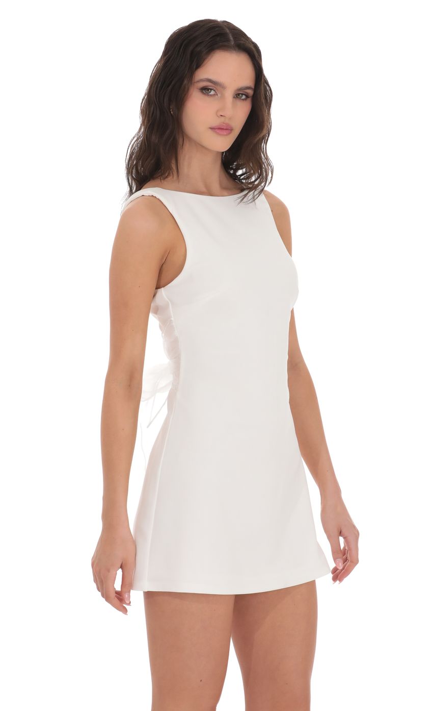 Picture High Neck Back Bow Dress in White. Source: https://media-img.lucyinthesky.com/data/product-media/850xAUTO/a6f607dd-5130-48c1-a2cd-c034b631c42f.jpg