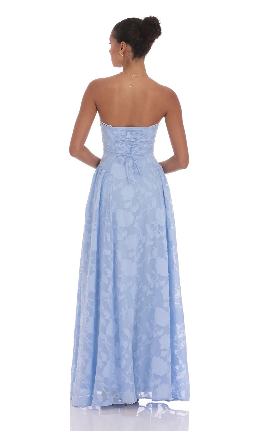 Picture Floral Lace-Up Maxi Dress in Light Blue. Source: https://media-img.lucyinthesky.com/data/product-media/850xAUTO/b6550f55-26dd-424d-9587-1f00d4c80ff7.jpg