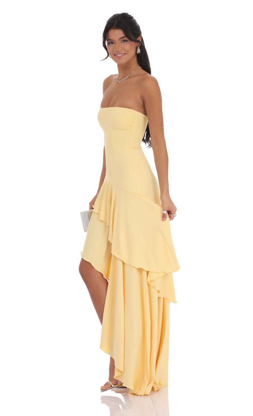 Picture Strapless Ruffle Asymmetrical Maxi Dress in Yellow. Source: https://media-img.lucyinthesky.com/data/product-media/850xAUTO/bf2c0aea-438c-49d0-9954-202ac3554c10.jpg