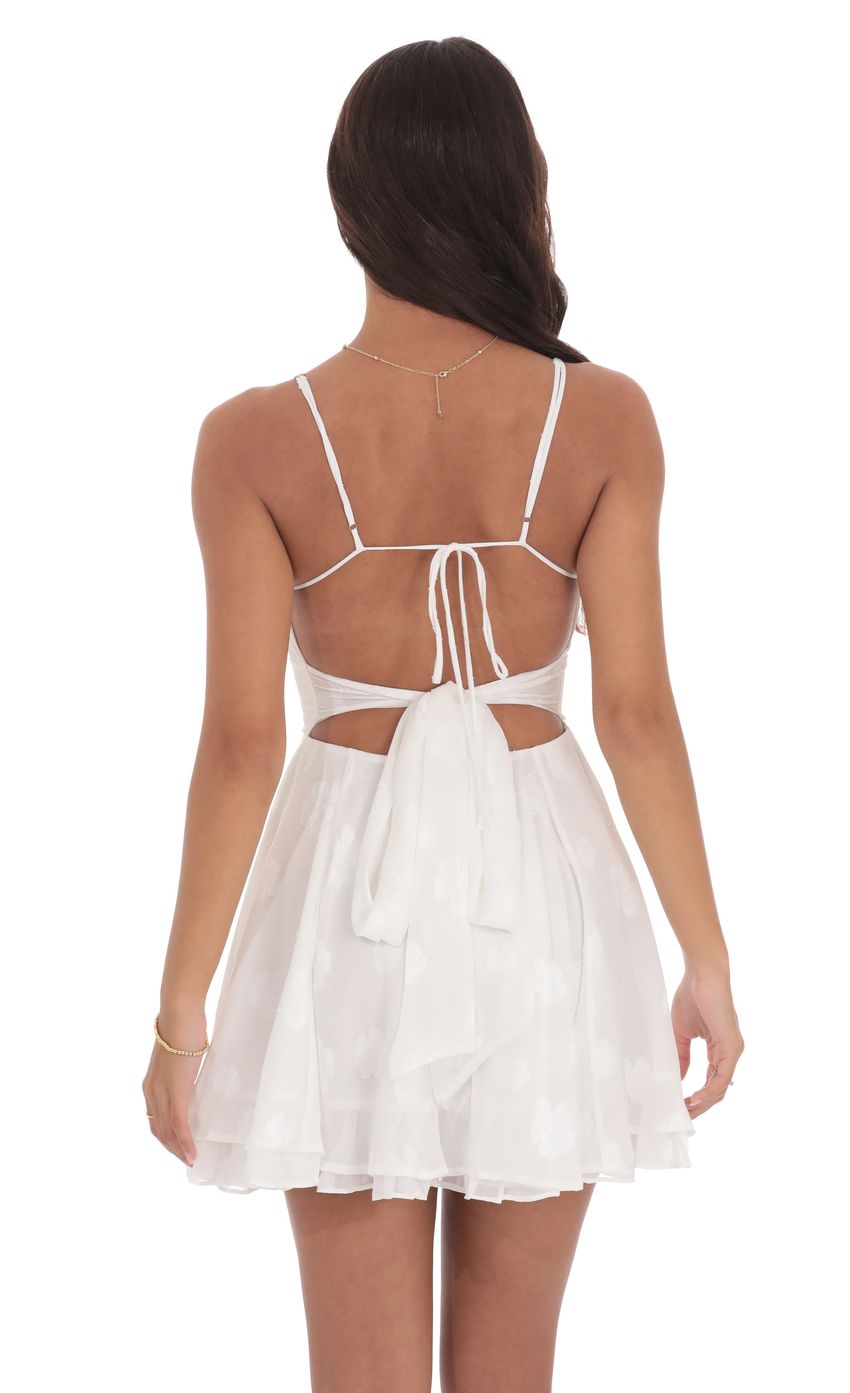 Picture Fit and Flare Dress in Floral White. Source: https://media-img.lucyinthesky.com/data/product-media/850xAUTO/cb561334-8f2a-4551-9a76-156bc9eadf67.jpg