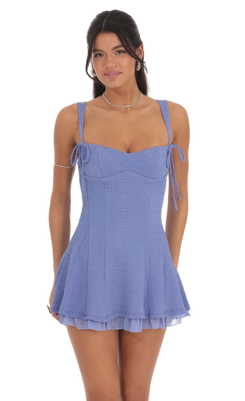 Picture Chevron Double Bows Ruffle Dress in Periwinkle. Source: https://media-img.lucyinthesky.com/data/product-media/850xAUTO/f16af2a2-e5af-44fb-afe6-b872fb34076b.jpg